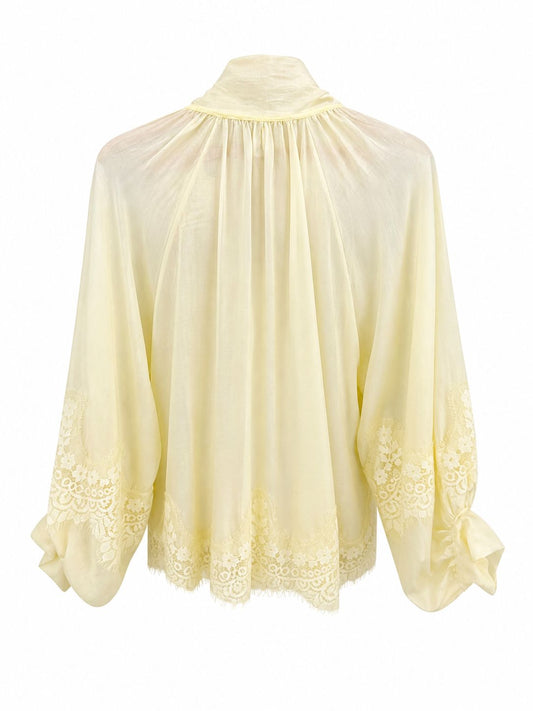 Camisa amarilla lazada con encajes